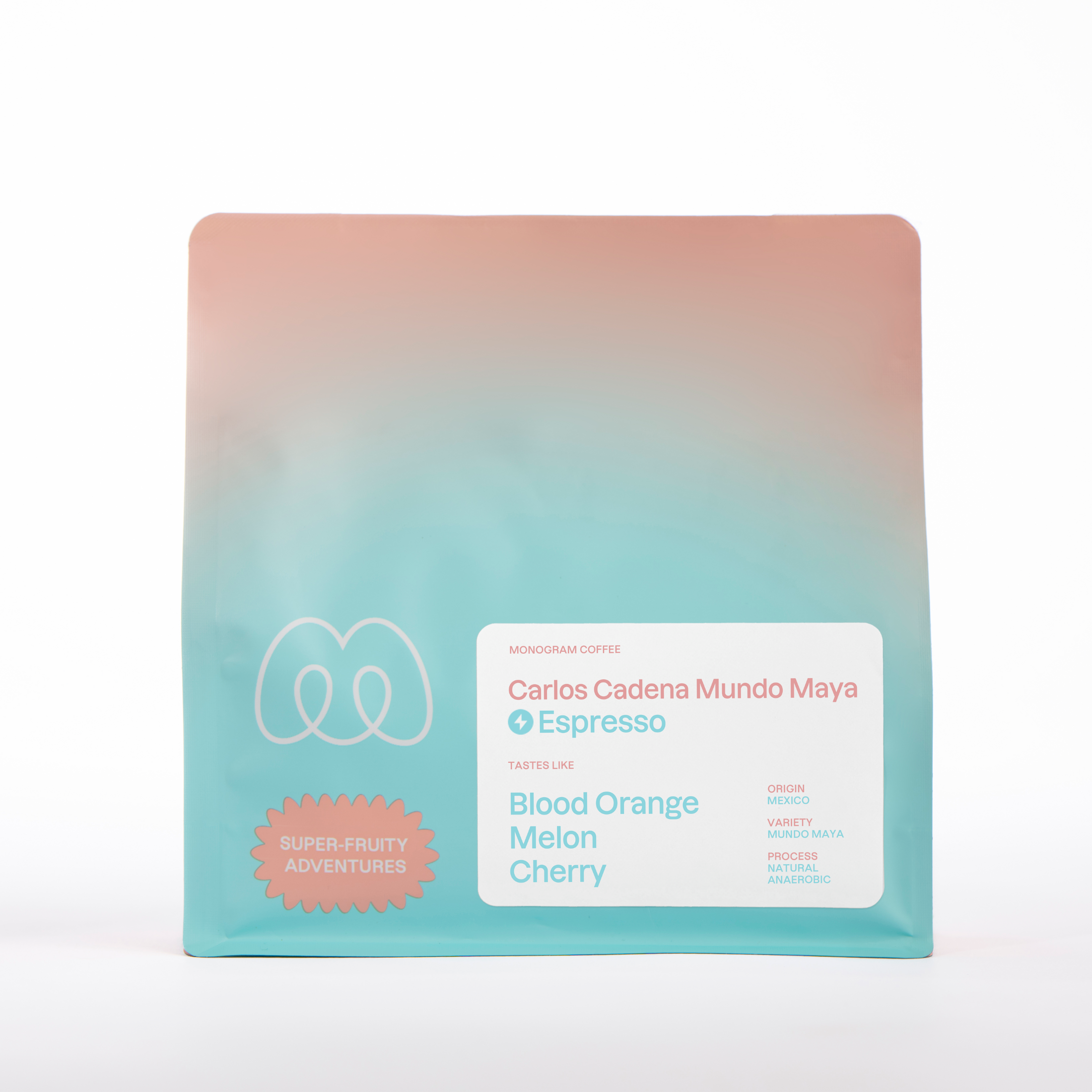 A teal and peach gradient bag of Monogram Carlos Cadena espresso coffee, a natural anaerobic Mundo Maya variety from Mexico with tasting notes of blood orange, melon, and cherry.